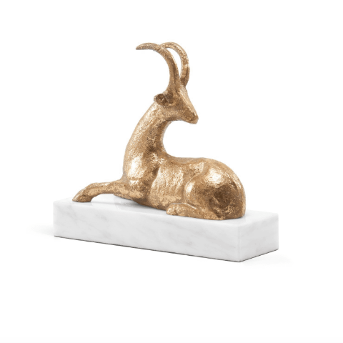 Hand-leafed Metal antelope statue on marble base. 
